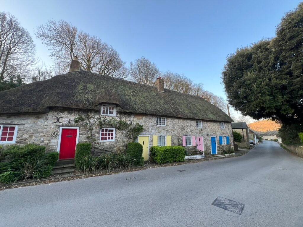 Four colour doors cottages in West Lulworth including the blue door which is Honeysuckle Cottage