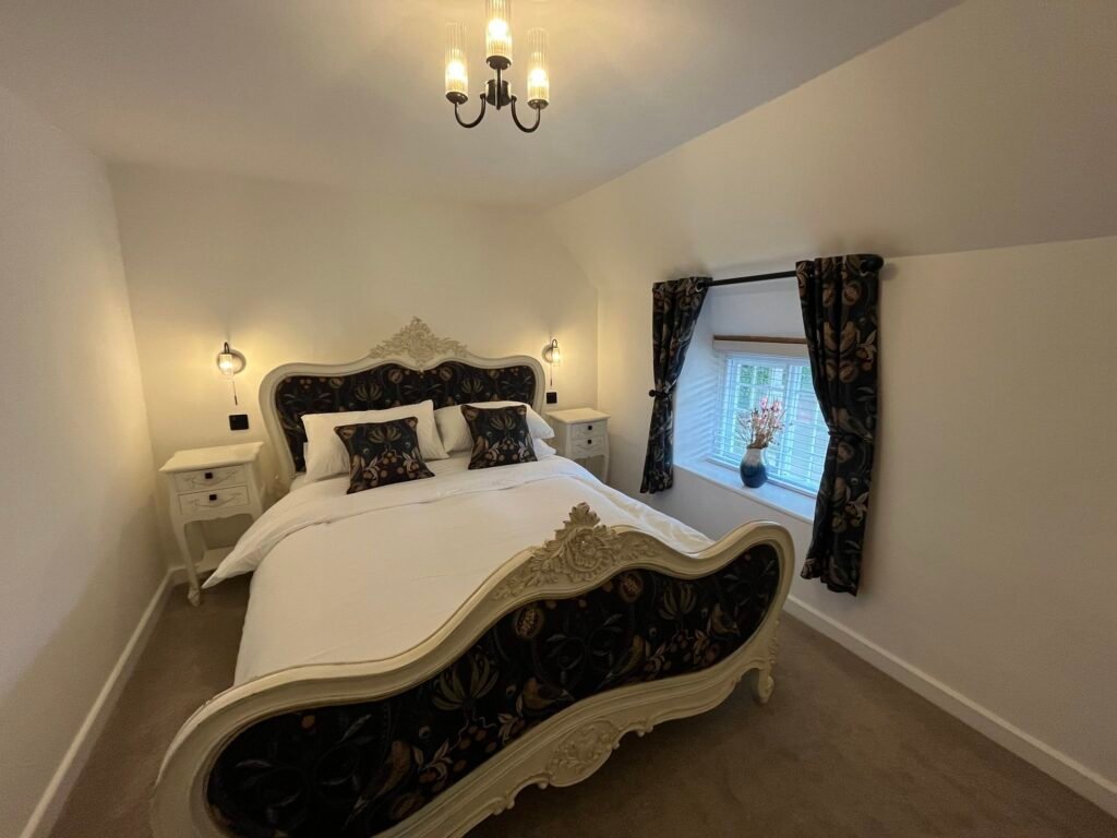 A luxurious bedroom at Honeysuckle Cottage in West Lulworth