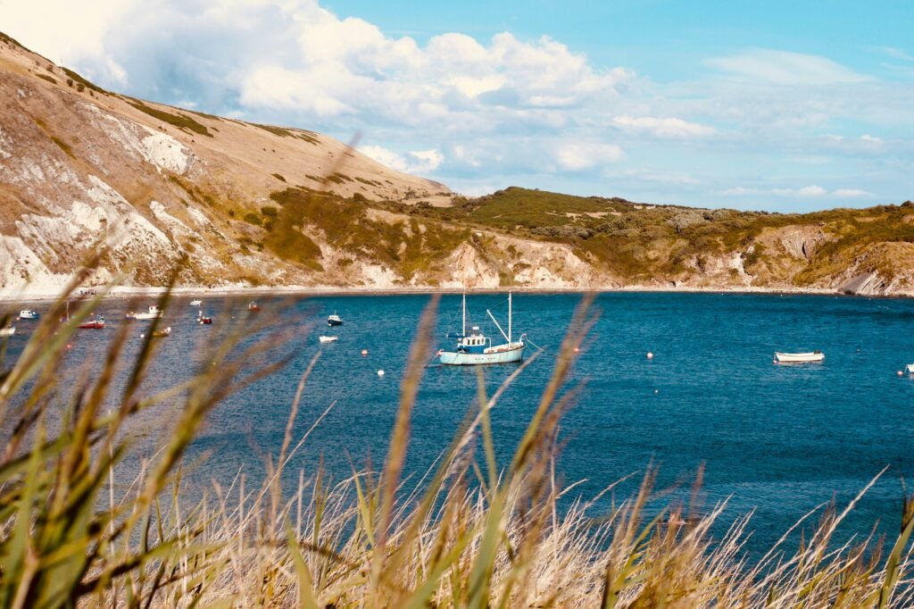 A boat in the middle of Lulworth Cove