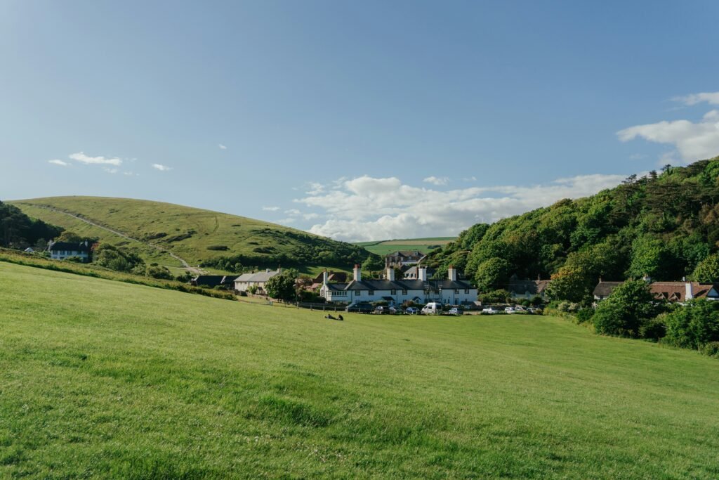 Lulworth Lodge and the Coastguard Cottages in Lulworth with Coastguard Green