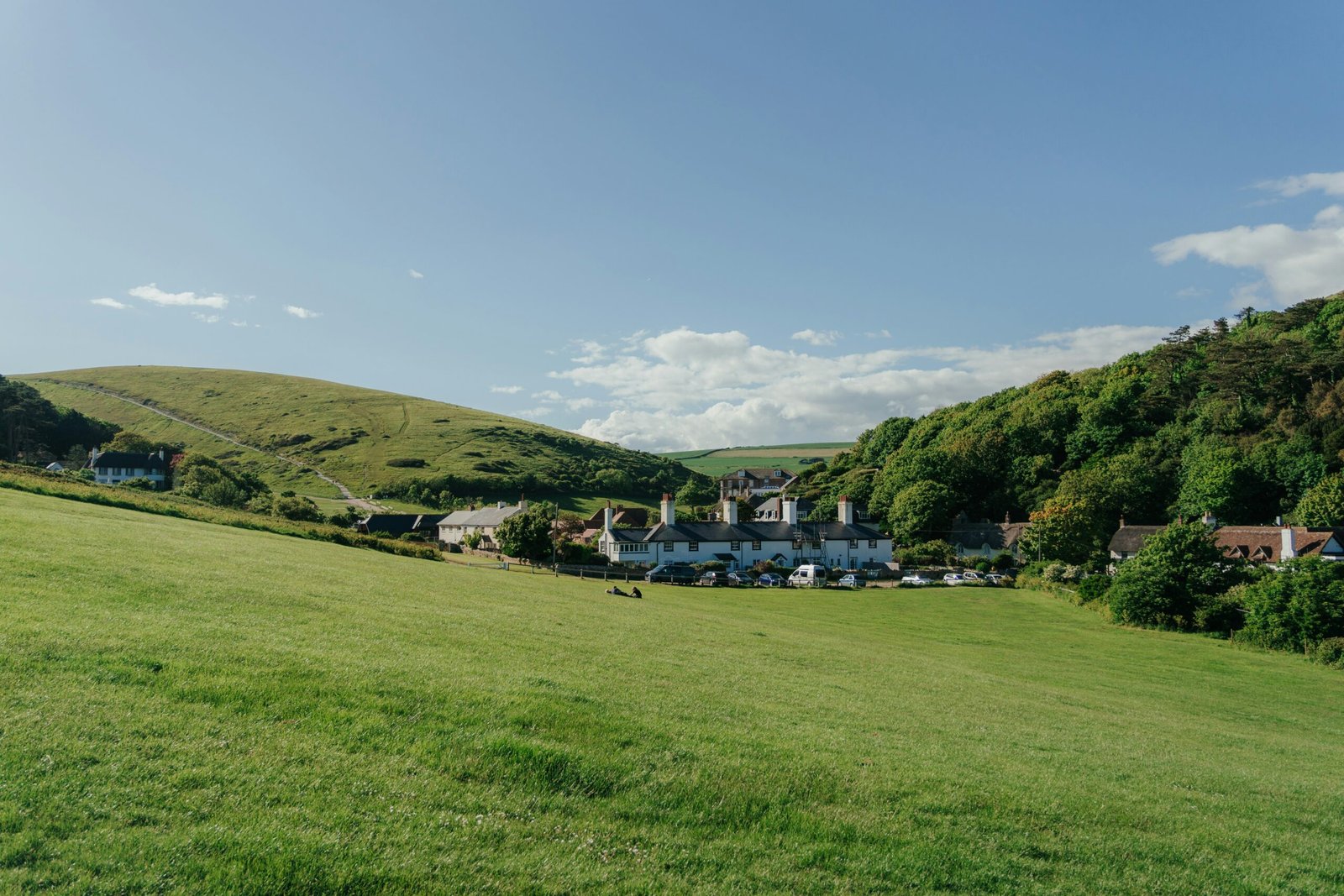 Lulworth Lodge and the Coastguard Cottages in Lulworth with Coastguard Green